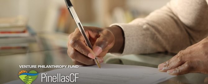 Closeup of a Black man completing a Foundation for a Healthy St. Petersburg Empowerment Grant.