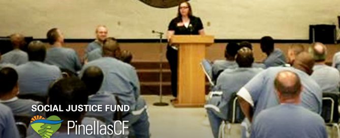 Bethany McNeil of XO Factor speaks to a room full of prisoners awaiting release.