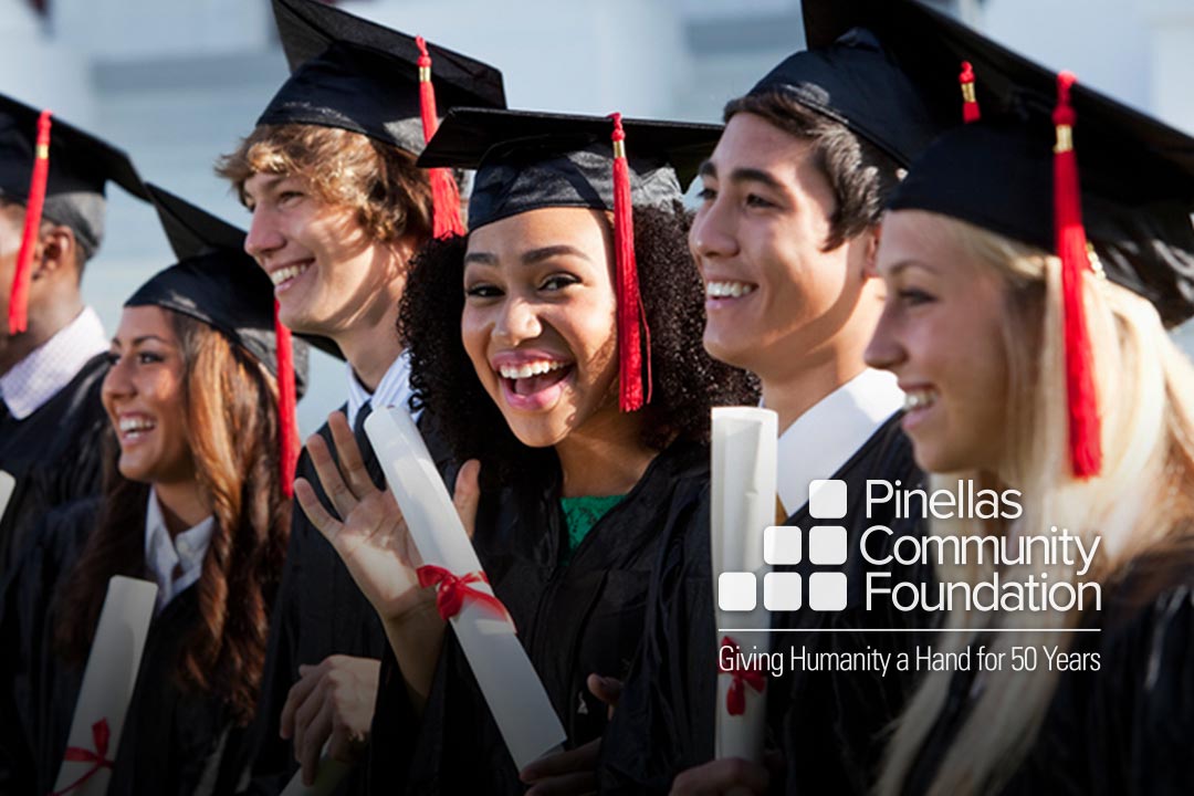 College graduates smiling because they received scholarships