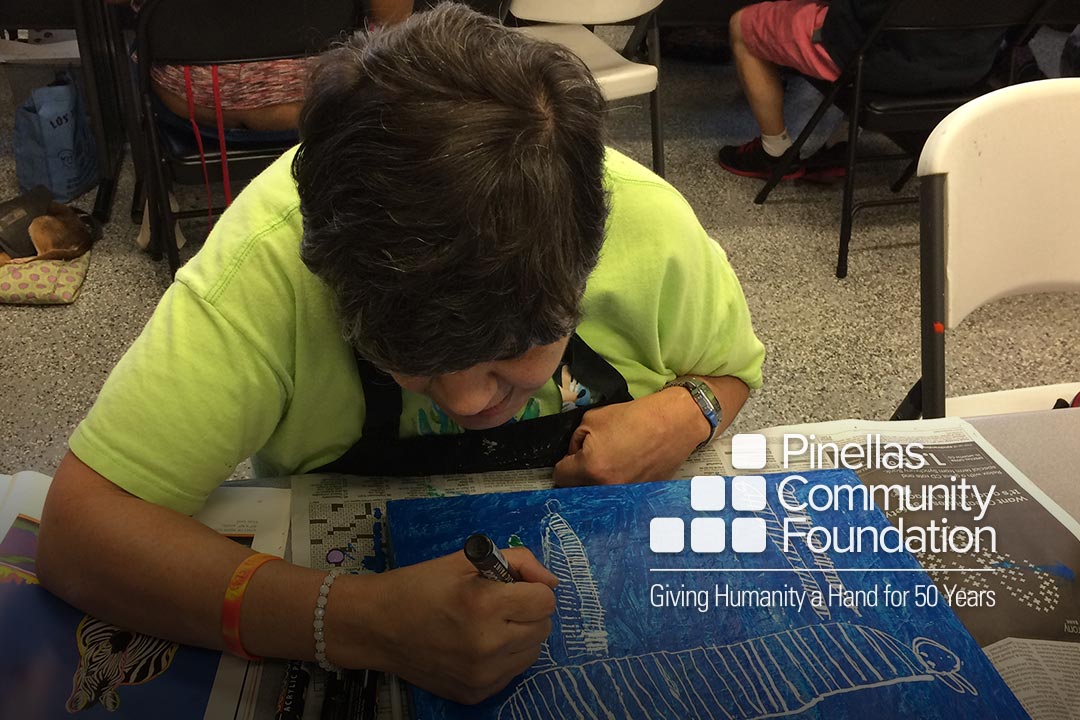 Woman exploring aging through community painting project