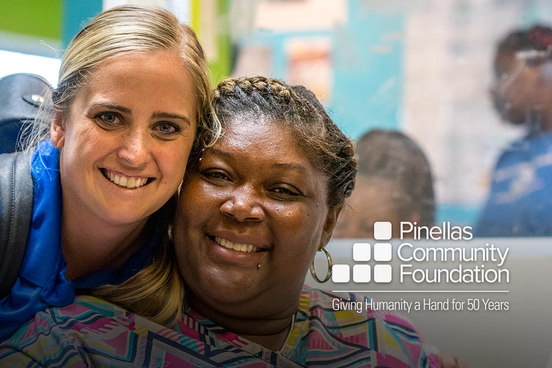 Two smiling women at the Boys & Girls Club