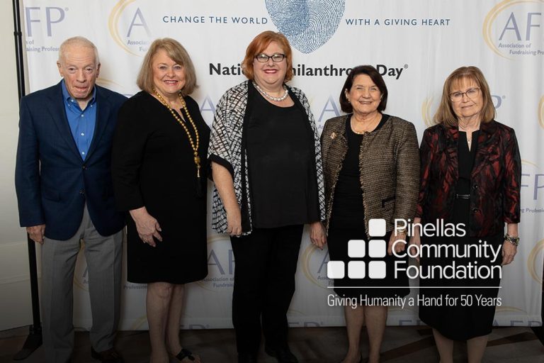 Former PCF Board Member Sandra Diamond poses with guests after winning the Spirit of Philanthropy Award.
