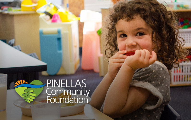 Children at a St. Petersburg school eat healthy meals provided by a PCF grant throughout the day to fight childhood hunger.
