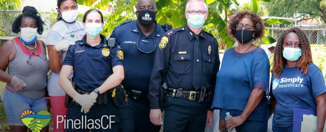 Clearwater MLK Community Center members gather with police officers for an event.