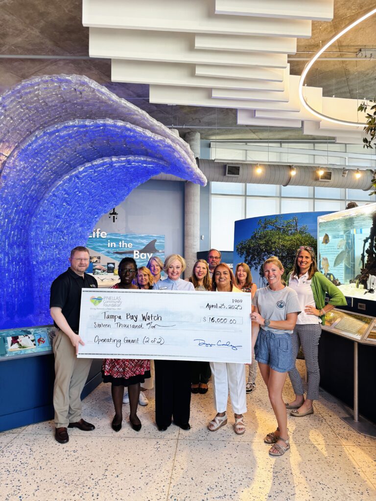 Tampa Bay Watch Discovery Center staff posing with Pinellas Community Foundation and a check presentation for an operating grant