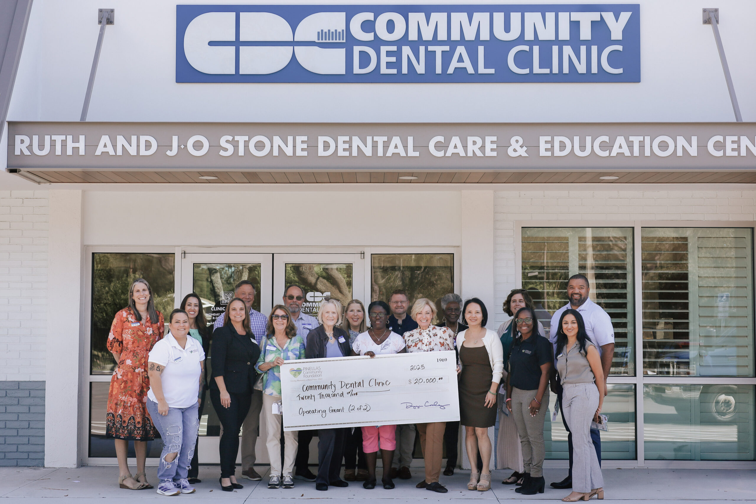 Community Dental Clinic: Dentist and patient discuss care in a treatment room serving uninsured adults.