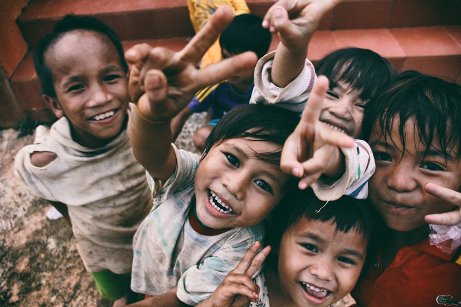A child's hands covered in paint at a community arts program.